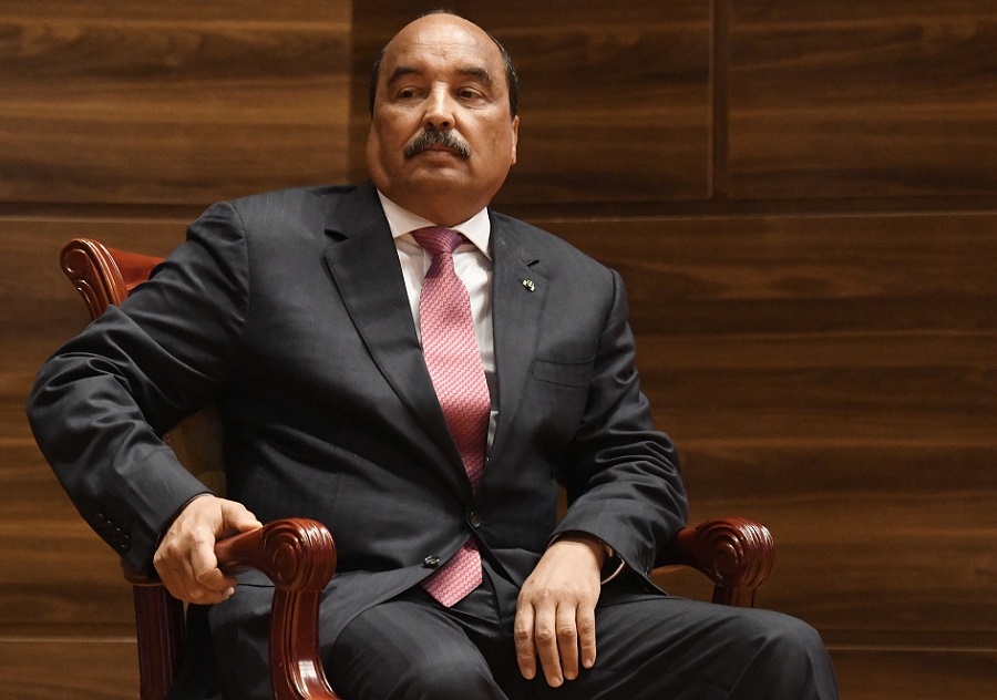 Mauritania's out-going President Mohamed Ould Abdel Aziz looks on during the swearing-in ceremony of the newly-elected Mauritania's President at a conference center in Nouakchott, on August 1, 2019. - Mauritania, roiled by a history of military coups and upheaval, saw its first transfer of power between elected leaders on August 1, 2019 as President Mohamed Ould Abdel Aziz handed over to his successor. Mohamed Ould Cheikh El Ghazouani was sworn in at a conference centre near the capital Nouakchott before a crowd of 5,000 people. (Photo by Seyllou / AFP)